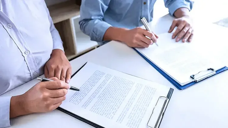 woman-man-sign-documents