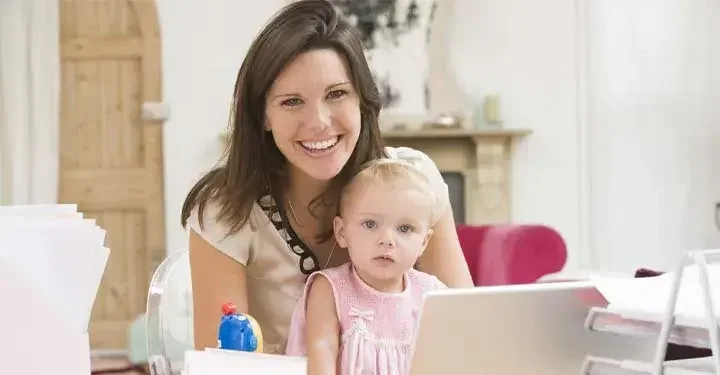 woman and baby at computer