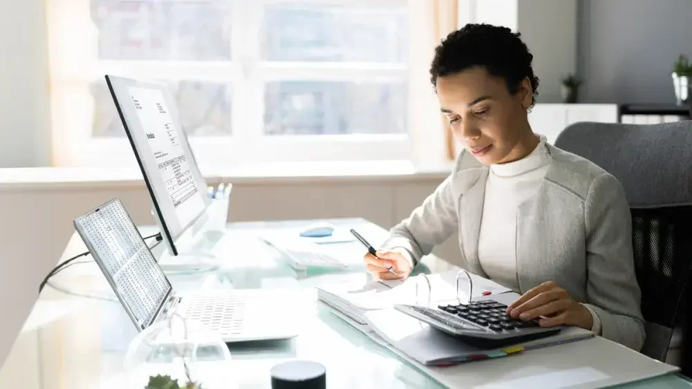 An accountant goes over documents in her office. Traditionally, finance, real estate, and insurance make up the largest sector of partnerships.