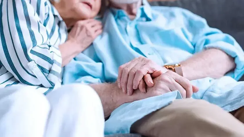 elderly-woman-man-hold-hands