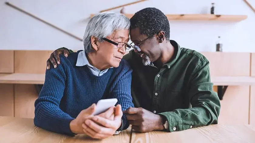 older men hugging