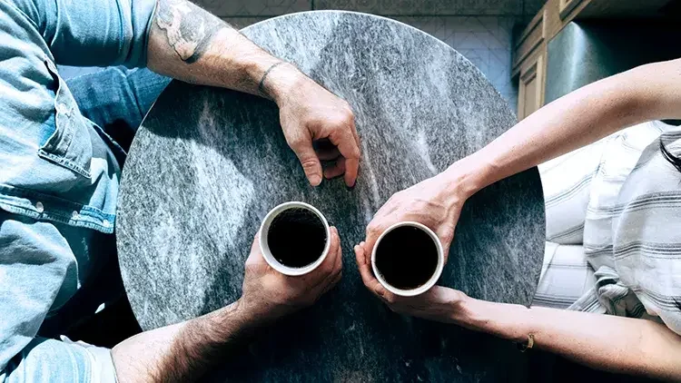 Man and woman having coffee