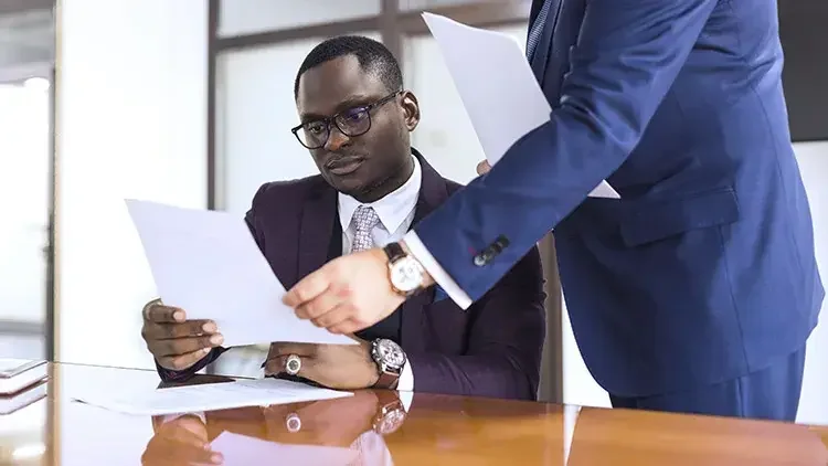 Man signing official document