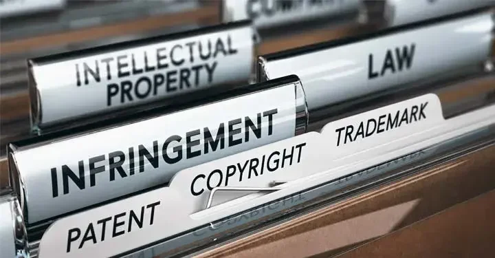 File tabs containing words "intellectual property," "infringement," "patent," "copyright," "trademark," and "law"