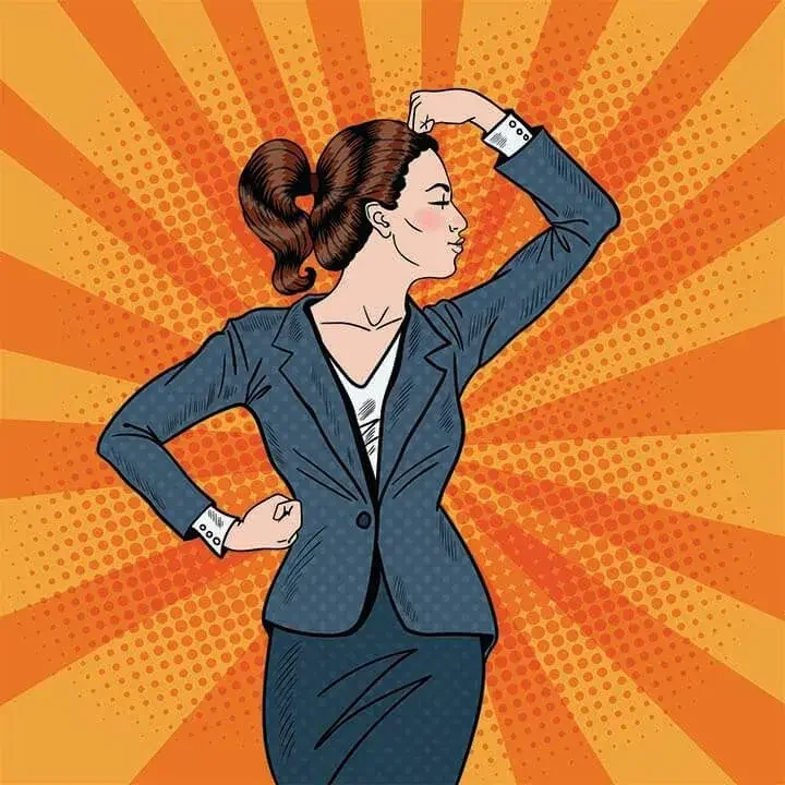 Woman in pantsuit standing in a power pose, kissing her muscles