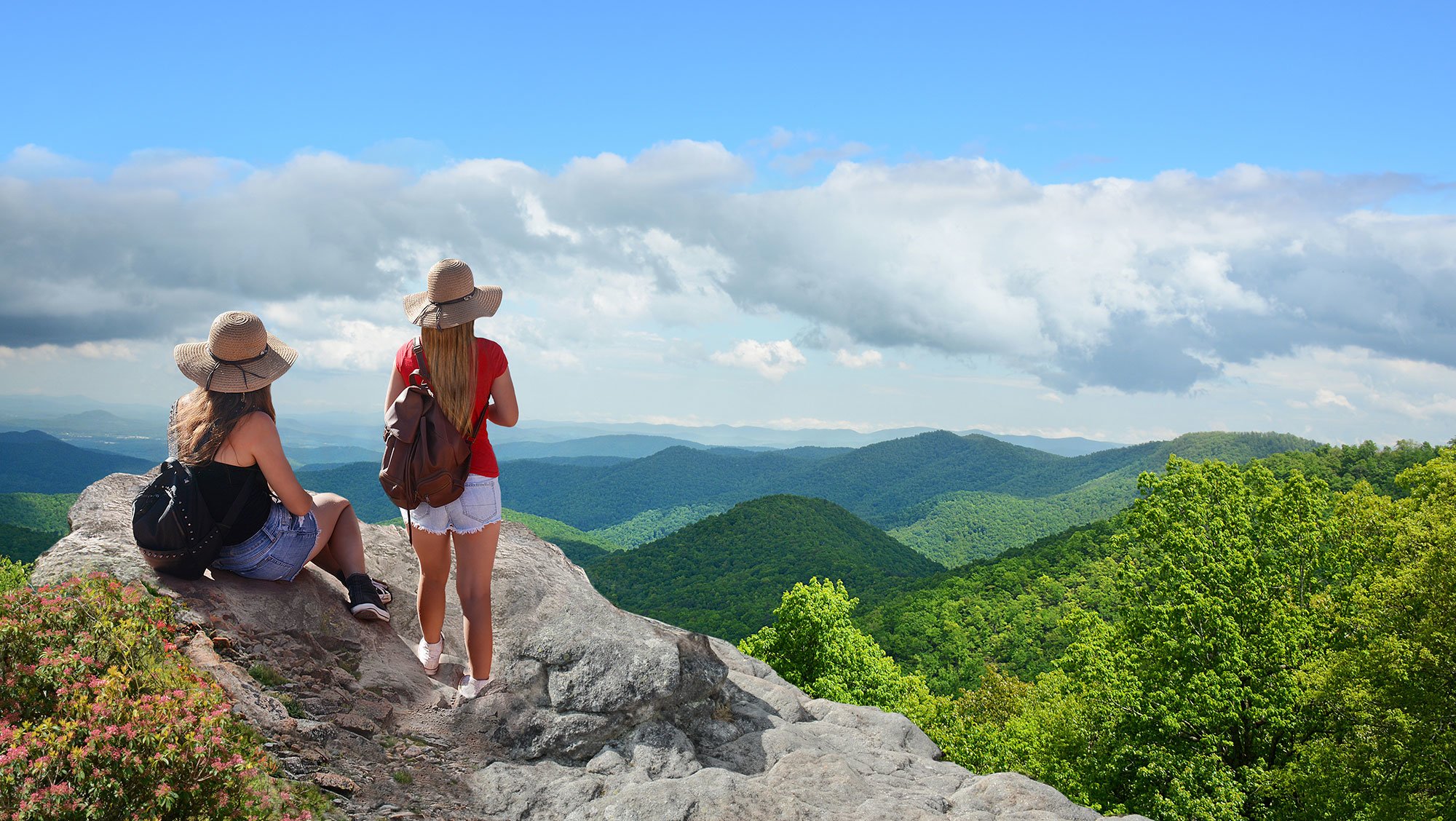 Cross Country color photo of two young women looking out upon green