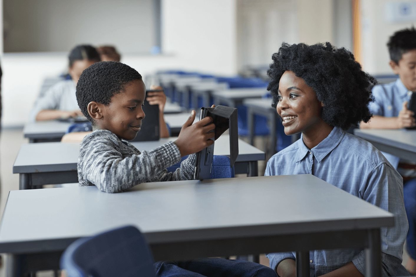 Cross Country Education color photo of a young woman teaching seated